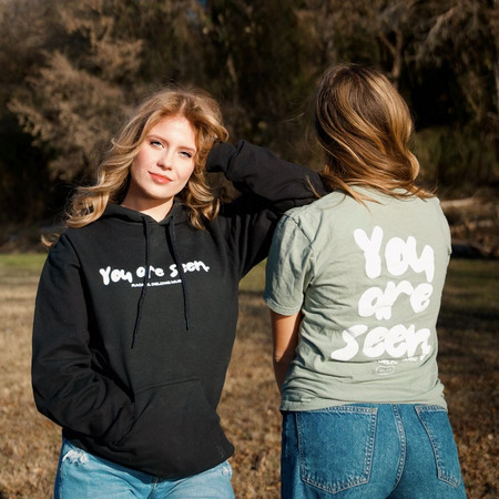 You Are Seen., a Black Gildan Softstyle Pullover Hoodie