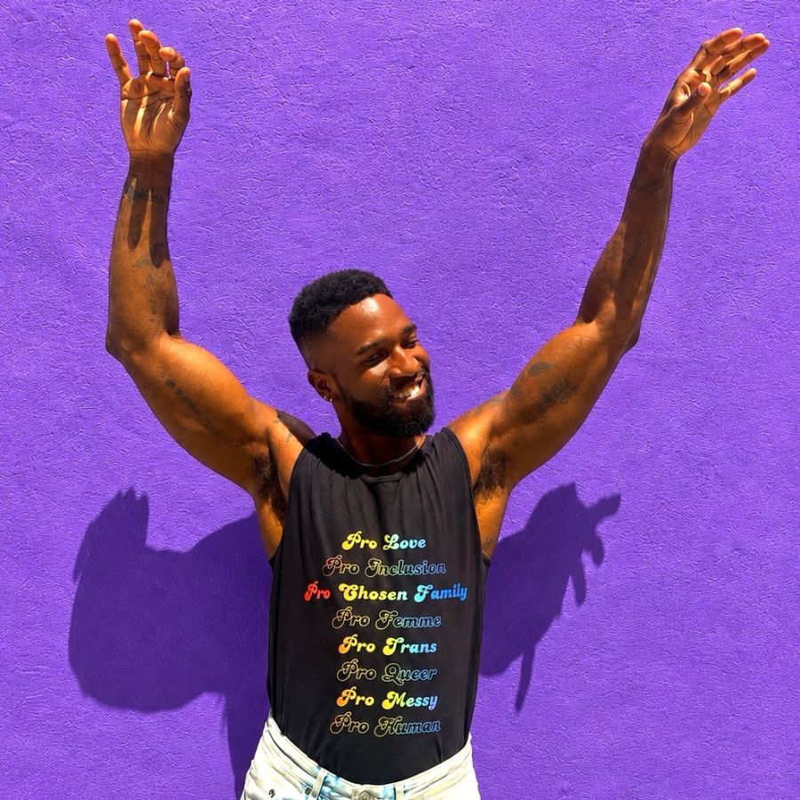 The Pro Human Tee, a Black Comfort Colors Tank Top