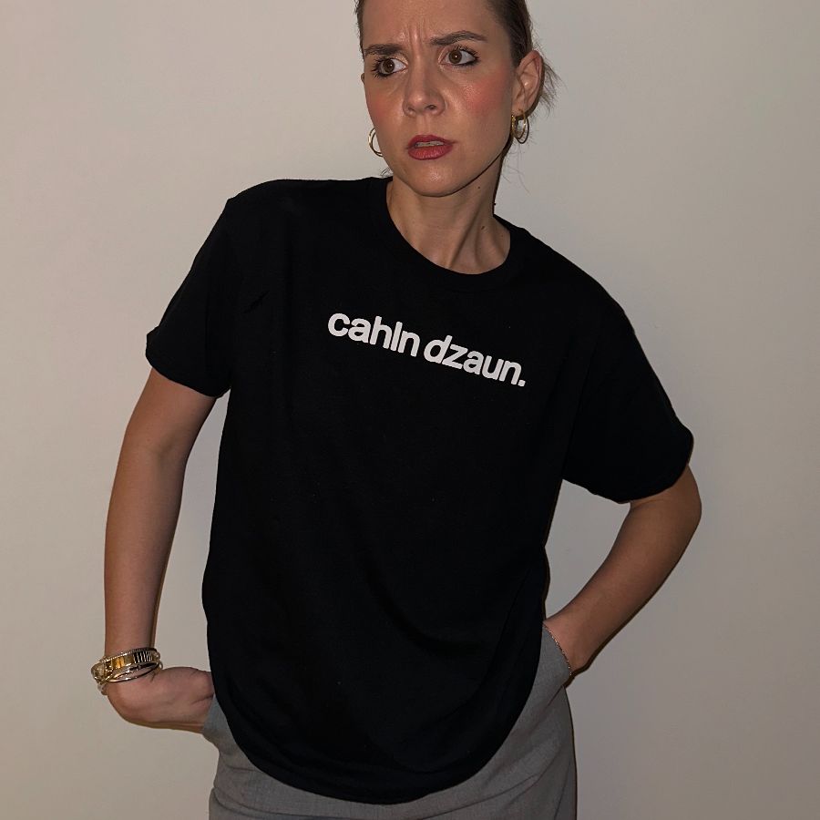 cahln dzaun. (white text), a Black Classic Unisex Tee