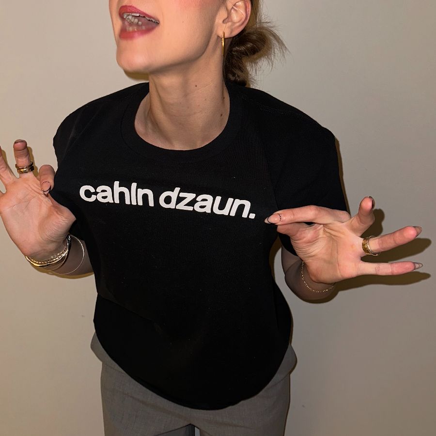 cahln dzaun. (white text), a Black Classic Unisex Tee