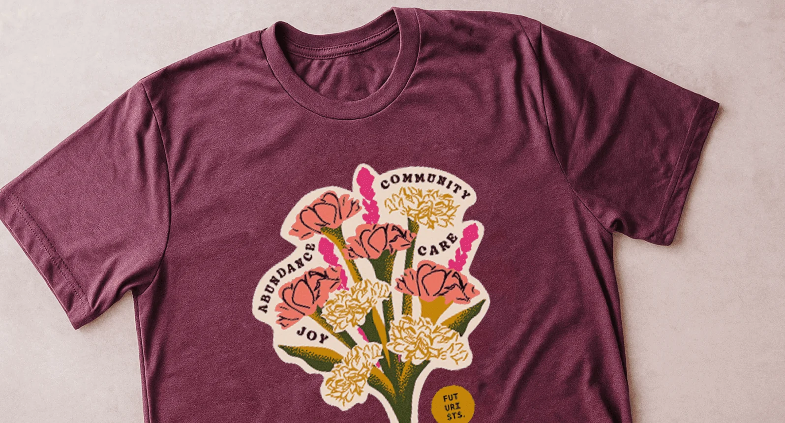 A maroon t-shirt with a floral design
