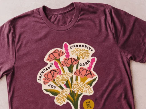 A maroon t-shirt with a floral design