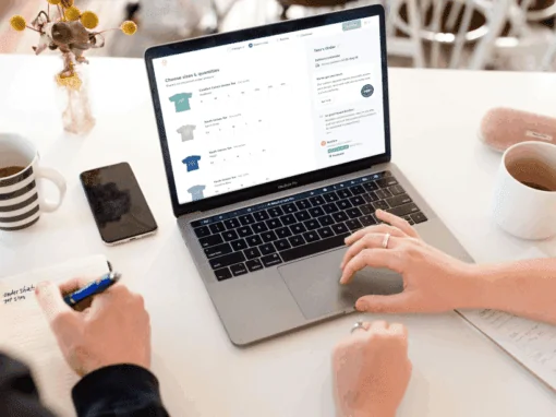 Customer is in the process of ordering group tees on a laptop