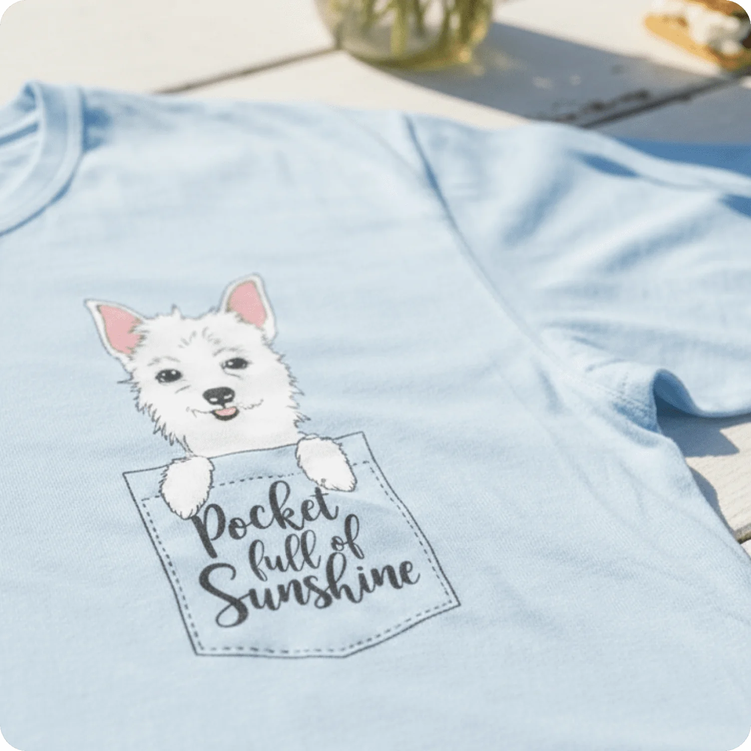 T-shirt featuring small pocket-style illustration with a friendly character design.