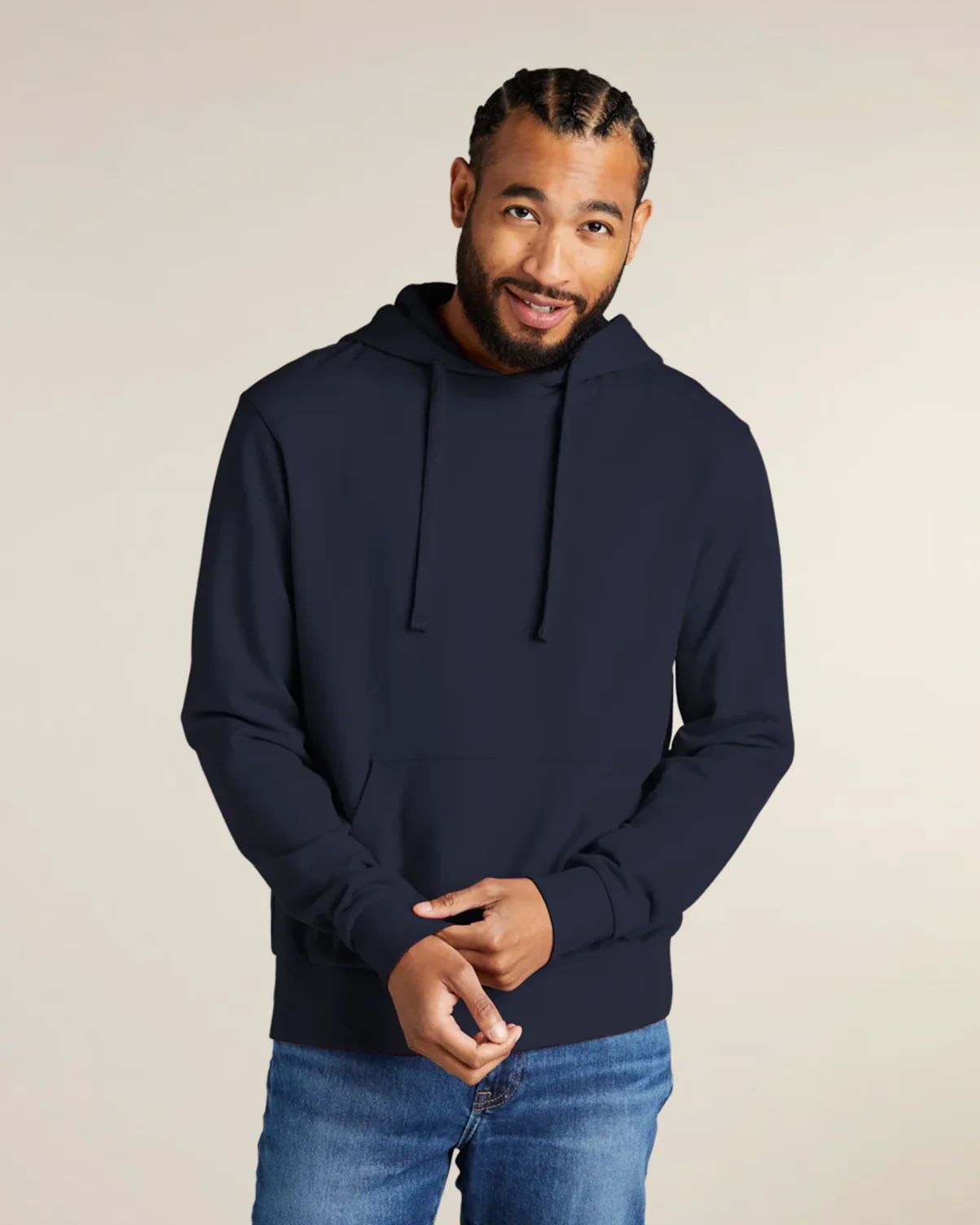 Man wearing a navy eco-friendly Organic French Terry Pullover Hoodie from Allmade