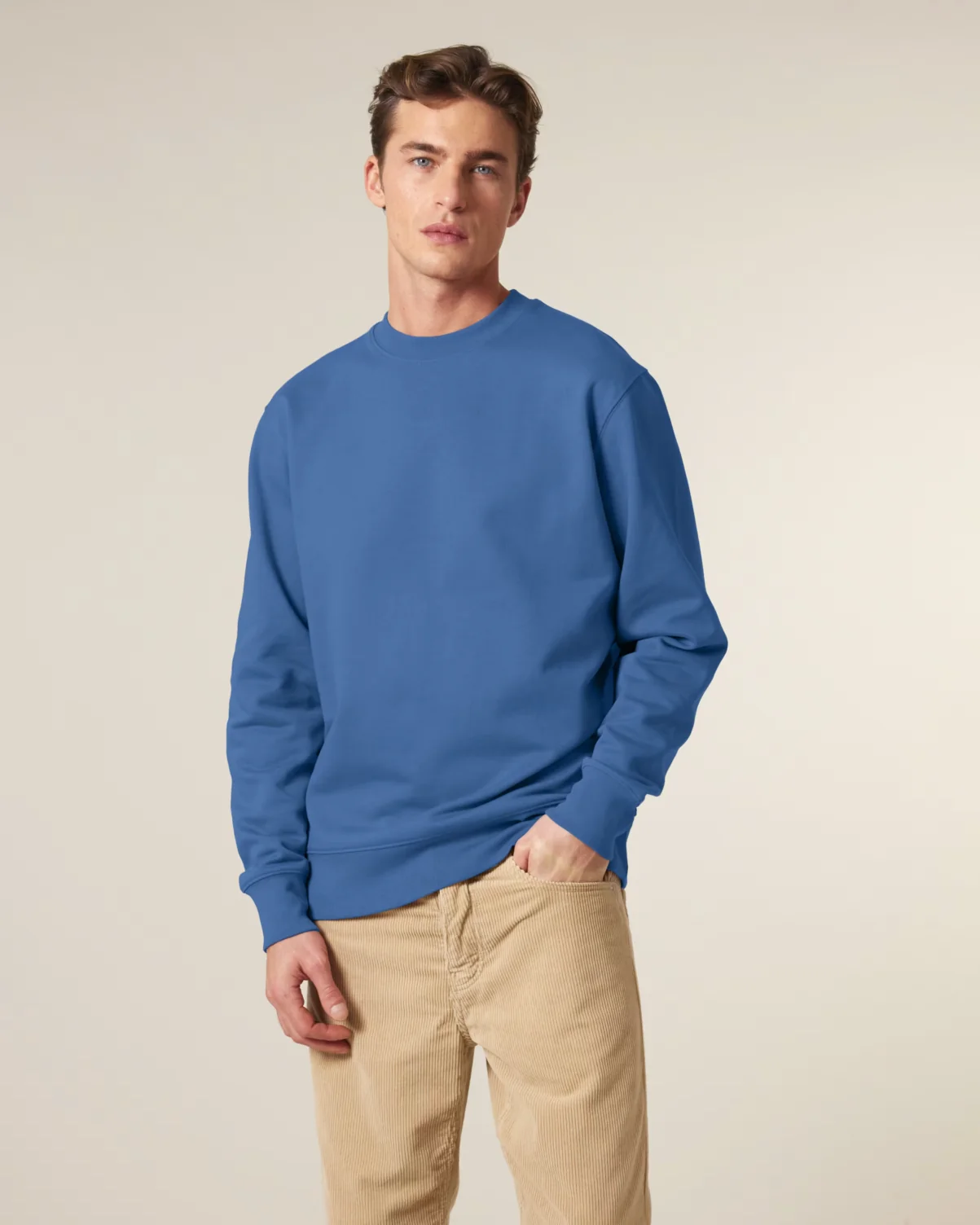 Male model wearing a Stanley/Stella Changer 2.0 Crewneck Sweatshirt in Mindful Blue