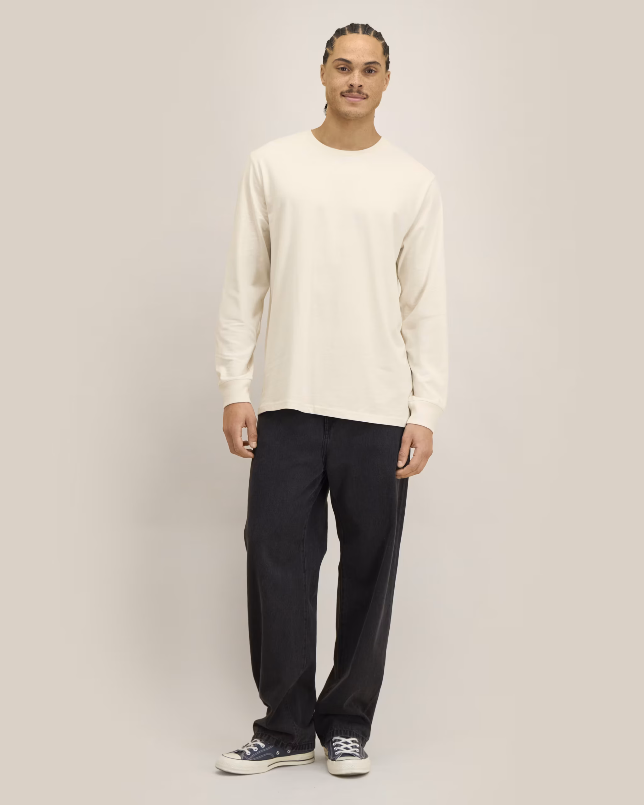 Male model wearing a Stanley/Stella Creator 2.0 Long Sleeve Tee in Natural Raw.