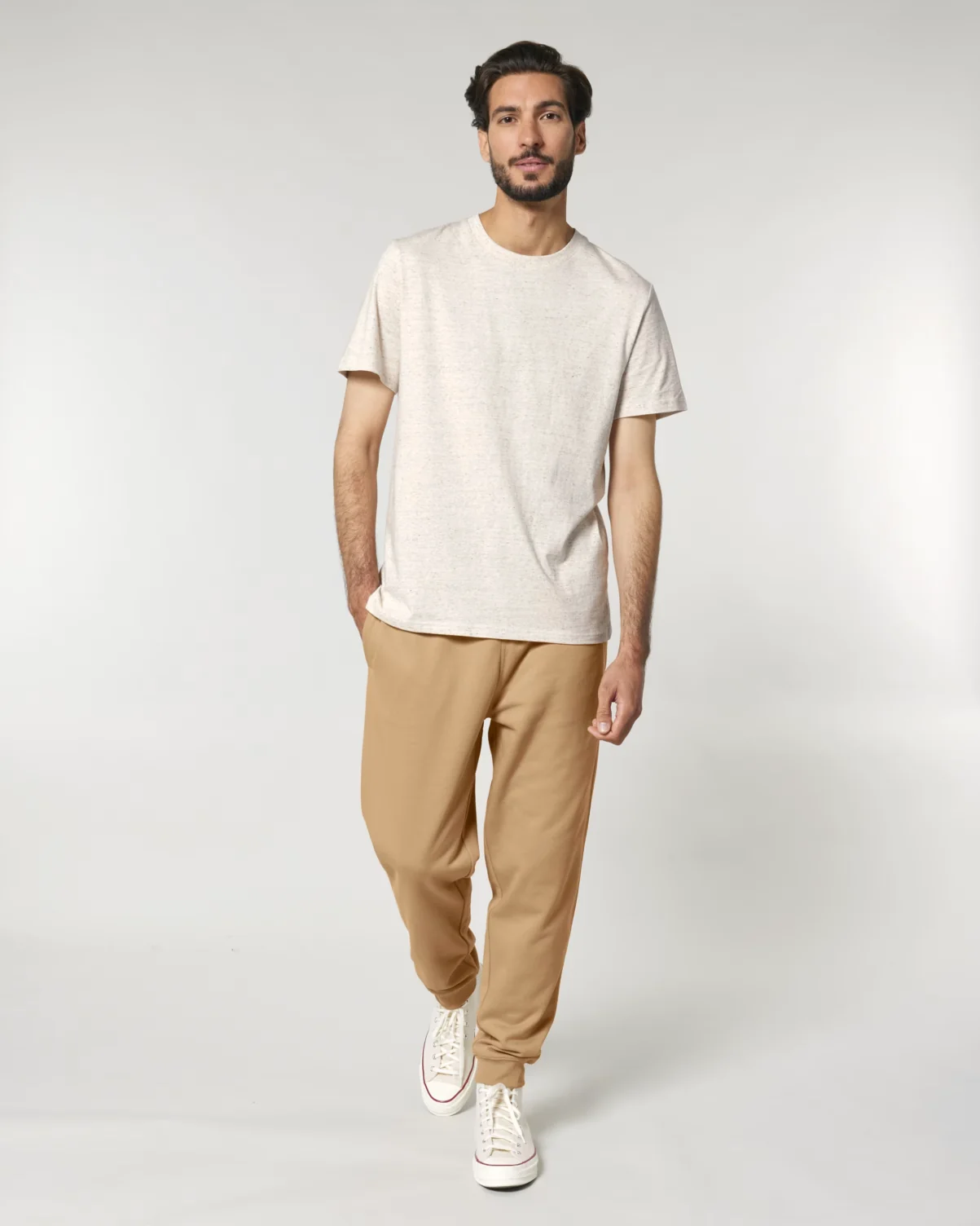 Man wearing beige Stanley/Stella joggers and a light t-shirt